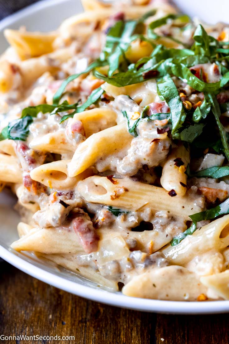 easy creamy sausage pasta with basil on top