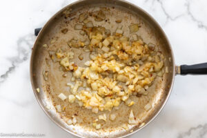 Step 2 How to make easy creamy sausage pasta, saute onion and garlic