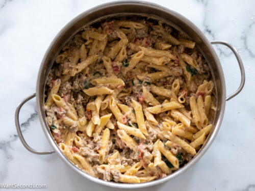 Step 5 How to make creamy tuscan sausage pasta, stir in cooked pasta