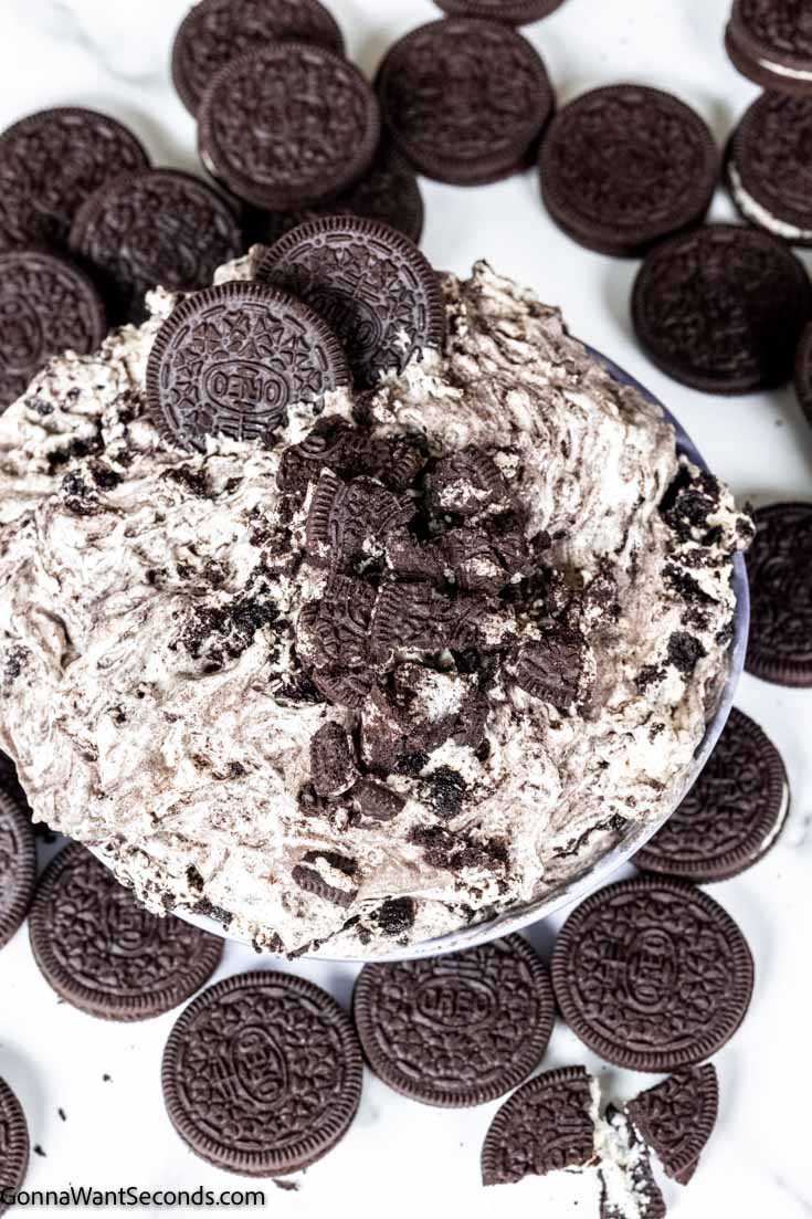 oreo fluff recipe with cream cheese topped with crushed oreos in a bowl