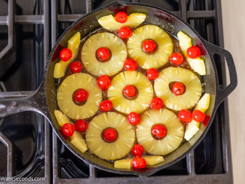 Step 4 how to make pineapple upside down cake, arrange the cherries