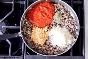 Step 2 how to make spaghetti with taco seasoning, add the sauce, and seasonings