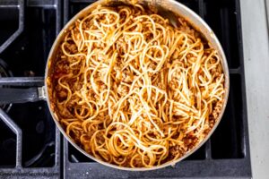 Step 3 how to make spaghetti tacos, mix the cooked spaghetti