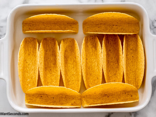 Step 4 how to make spaghetti with taco seasoning, arrange the taco shells in a baking dish
