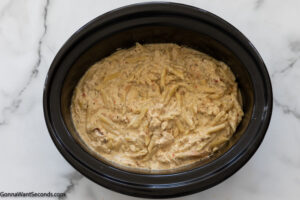 Step 6 how to make garlic parmesan chicken pasta with buffalo wild wings sauce, add pasta and heavy cream