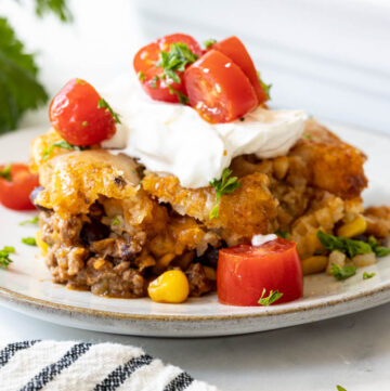 A serving of Mexican tater tot casserole on a plate