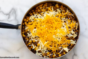 Step 5 how to make Mexican tater tot casserole, add the cheese