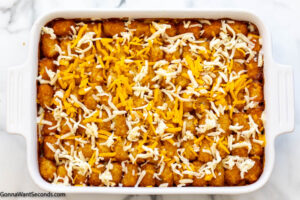 Step 7 how to make taco tater tot cassorole, bake then add cheese on top