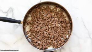 Step 2 how to make mexican tater tot casserole with black beans, brown the ground beef until there is no longer any pink