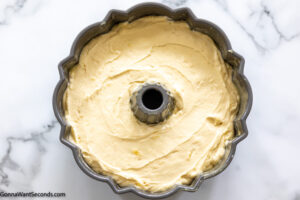 Step 7 how to make best pineapple pound cake, Pour batter into the bundt pan. Bake.