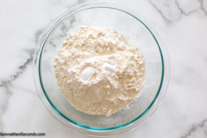 Step 1 how to makepineapple pound cake, Mix flour, baking powder, and salt.