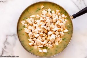 Step 6 how to make chicken and dumpling casserole, Stir in cookied chicken and Worcestershire sauce.