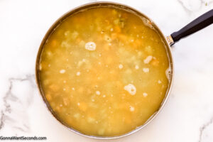Step 4 how to make chicken and dumpling casserole with vegetables, Stir in the broth and bring to a boil.