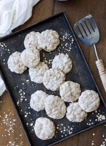 iced oatmeal cookies on a sheet pan