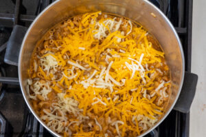 Step 7 how to make taco mac and cheese, add the remaining cheese