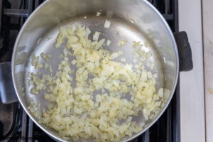 Step 1 how to make taco mac and cheese, saute onions and garlic