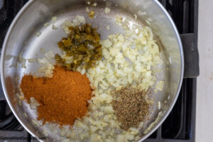 Step 2 how to make easy taco mac and cheese, stir in chiles, taco seasoning, and oregano