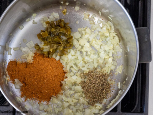Step 2 how to make easy taco mac and cheese, stir in chiles, taco seasoning, and oregano