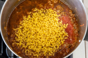Step 5 how to make taco macaroni and cheese, stir in and cook the pasta
