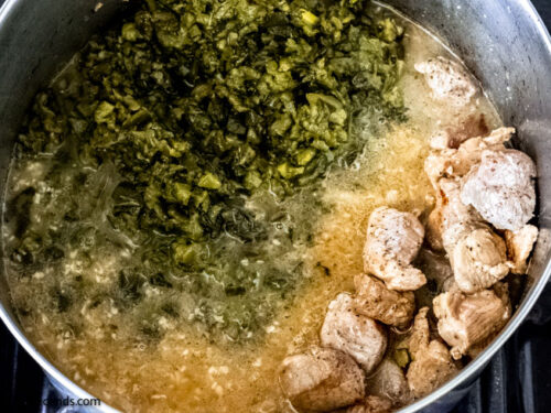 Step 9 how to make green chile stew with pork, Add chopped chiles. Boil. Stir in the potato chunks and simmer.