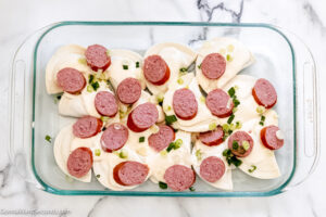 Step 4 how to make lazy pierogi casserole , sprinkle half the green onions over sausage