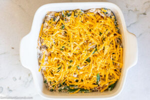 Step 11 how to make Paula Deen Green Bean Casserole, Add cheddar then bake again until melted.