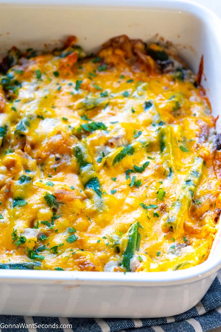 old fashioned green bean casserole with melted cheese on top