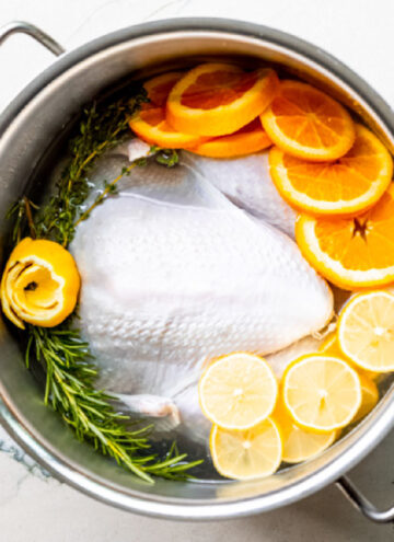 turkey brine with fresh herbs and citrus in a pot