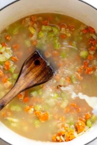 Step 7 how to make southern chicken and dumplings,Add stock, wine, sugar,