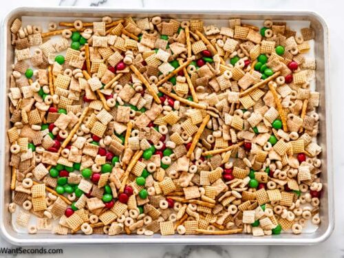 Step 2 how to make White Christmas Chex Mix, Transfer the mixture to a baking sheet.
