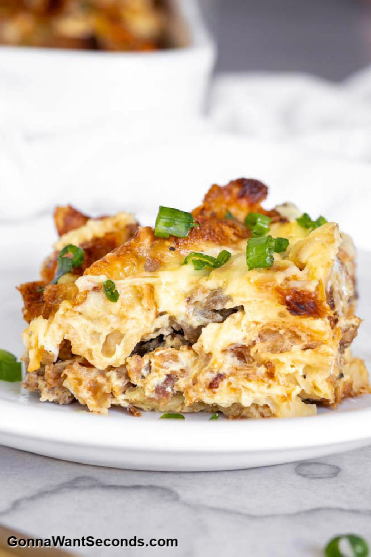 A slice of croissant sausage breakfast casserole on a plate