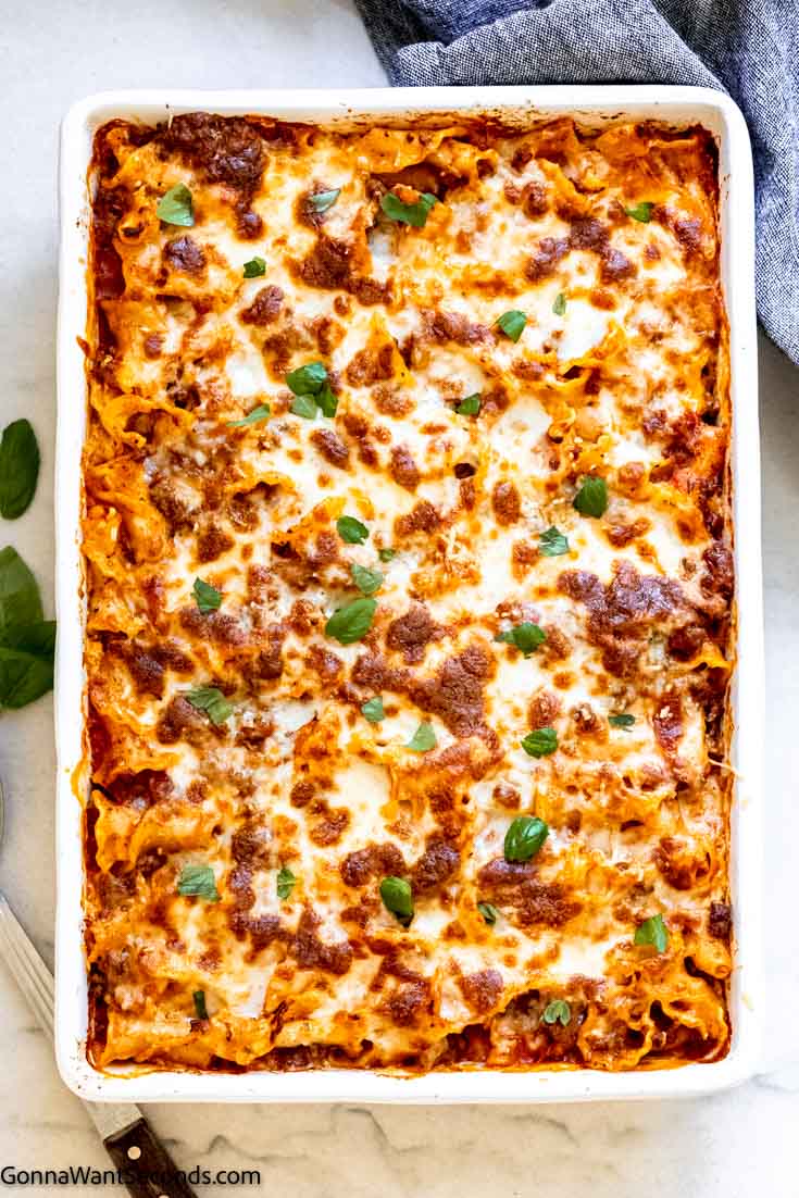 This lasagna casserole has all the deliciousness and cheesiness of traditional lasagna with a fraction of the work! The perfect weeknight dinner. #lasagna #lasagnacasserole lazy lasagna casserole topped with melted cheese, top shot