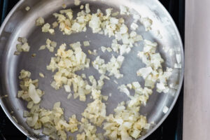 Step 1 how to make lasagna casserole, saute the onion and garlic