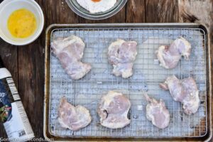 Step 4 how to make air fryer chicken, Take the chicken out of the ziplock bags and place it on a wire rack so any extra marinade will drip off.