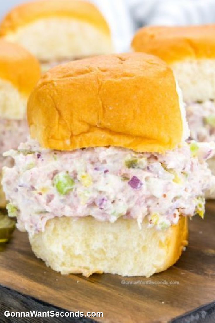 My ham salad is the best thing you can make with leftover ham! Serve it on Hawaiian rolls or on buttery crackers. This one is a must-try! #hamsalad #hamrecipes creamy ham salad in a dinner roll