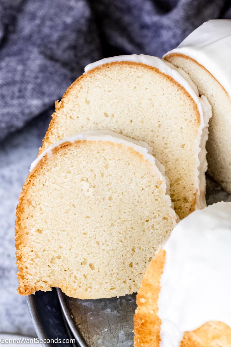 This buttermilk pound cake is very tender, moist, delicate, and has a buttery flavor with a lovely hint of lemon. #buttermilkcake #poundcake Slices of buttermilk bundt cake