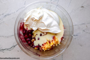 Step 1 how to make cherry fluff, In a large bowl, combine the first 4 ingredients.