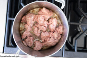 Step 2 how to make old fashioned cowboy baked beans, Brown and crumble the sausage. Set aside.