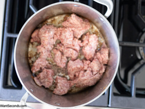Step 2 how to make old fashioned cowboy baked beans, Brown and crumble the sausage. Set aside.