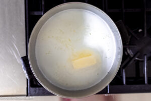 Step 2 how to make how to boil corn on the cob, Add the milk, butter, and sugar to the boiling water.
