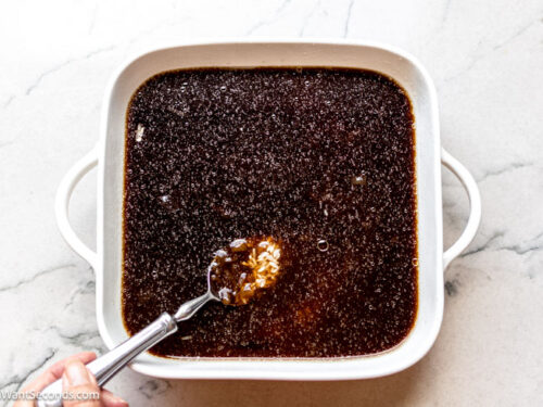 Step 1 how to make stick of butter rice, Combine rice, French onion soup, and beef broth to the baking dish.