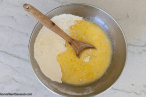 Step 4 how to make honey butter cornbread, Add the wet ingredients to the flour mixture.