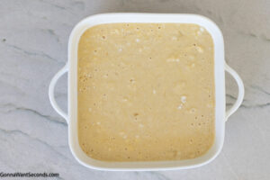 Step 5 how to make honey butter cornbread, Transfer the batter to the prepared baking pan. Bake.