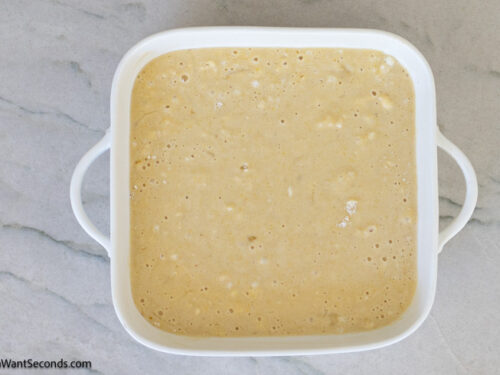 Step 5 how to make honey butter cornbread, Transfer the batter to the prepared baking pan. Bake.