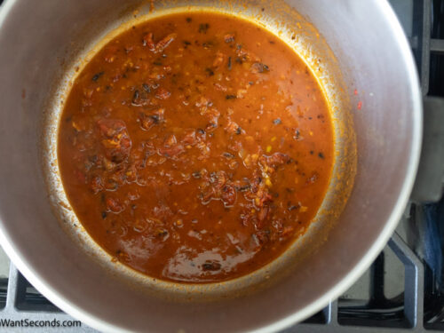 Step 6 how to make marry me chicken with tortellini, Add the tomato paste and broth.