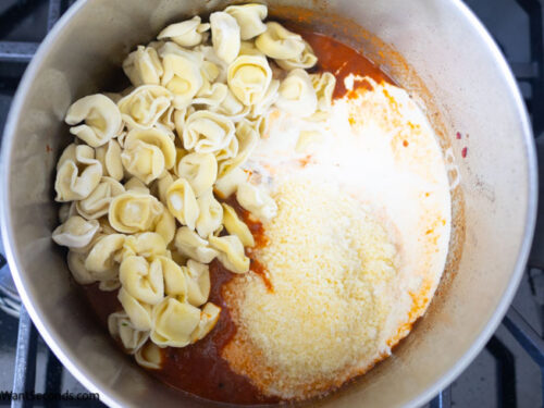 Step 7 how to make marry me chicken tortellini, Add the tortellini, heavy cream, and parmesan.