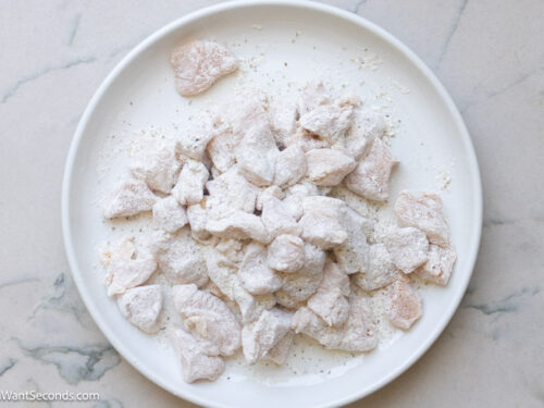 Step 2 how to make marry me chicken with pasta, Coat the cubed chicken with the flour mixture.