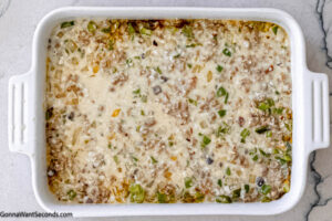 Step 9 how to make sausage and rice casserole with cream of chicken soup, Mix and cover with foil. Bake.