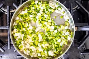 Step 2 how to make sausage rice cream of mushroom casserole, In the same skillet, saute celery, onion, garlic, and bell pepper.
