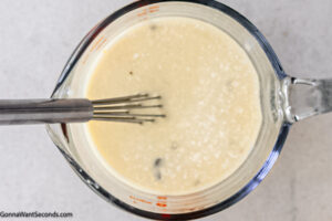 Step 4 how to make sausage and rice casserole, Whisk until well combined.